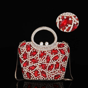 Macro shot of luxury red crystal clutch bag with metal frame and diamond embellishments