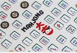 Macro detail of 5D embossed mahjong nail stickers with matte finish and lucky characters