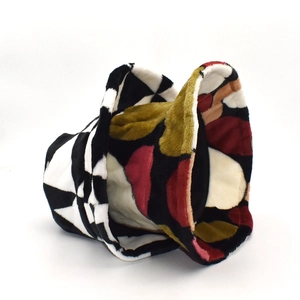 Detailed texture of thick plush coral fleece bucket hat with colorful geometric patterns