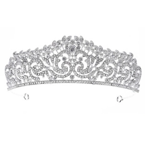 Detailed view of silver bridal crown featuring intricate floral patterns and crystal rhinestones