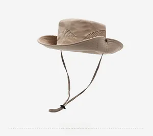 Detail of beige outdoor sun hat with breathable mesh vents and adjustable chin strap