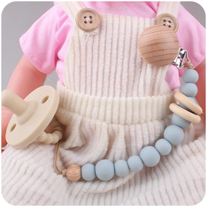 Silicone and beech wood baby pacifier clip with beads in soft Morandi blue and beige colors