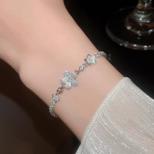 Detailed close-up of zircon floral bracelet showing intricate silver plating and sparkling gems