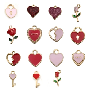Assorted DIY jewelry charms featuring red enamel hearts and floral alloy pendants