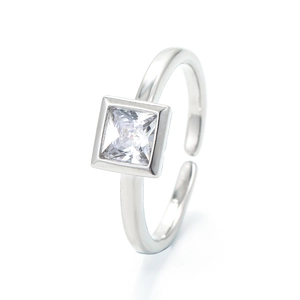Minimalist silver open ring with a square-cut zircon stone on a white background