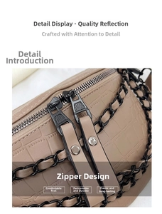Close-up of crocodile pattern leather waist bag with double black zippers and chain detail