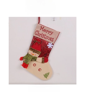 Detailed view of red Christmas stocking with 3D snowman figure and snowflake pattern
