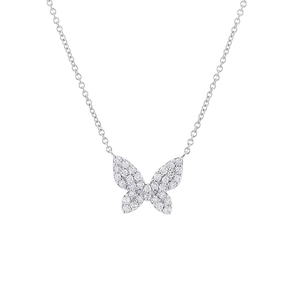Macro shot of silver butterfly necklace pendant with pavé set cubic zirconia detailing