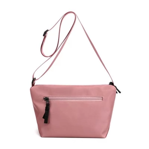Lightweight pink nylon dumpling crossbody bag with adjustable strap and front zipper