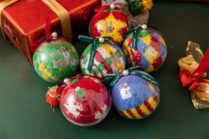 Detailed view of 6 pairs of Christmas fuzzy socks in festive clear bauble gift packaging