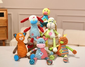 Detailed view of colorful patchwork animal plush toys with corduroy textures and embroidery
