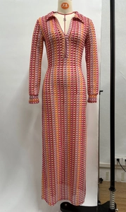 Detail of multi-color vertical striped crochet maxi dress with a plunging V-neck design
