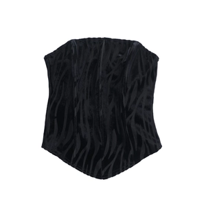 Detail of zebra pattern velvet corset top showing internal fishbone support and texture