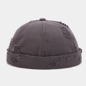 Close-up of dark grey cotton Miki hat with distressed frayed edges and ripped details