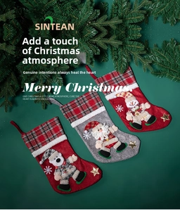 Flat lay of Christmas stockings featuring 3D Santa, snowman, and bear with pine needles