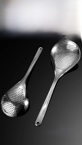 Detail of 304 stainless steel oil scoop showing fine mesh holes and polished long handle