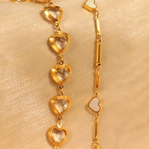 Elegant gold heart necklace set with transparent stones and white mother-of-pearl inlays