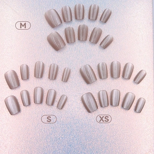Short square luxury brown cat-eye press-on nails in XS S M sizes on pink background