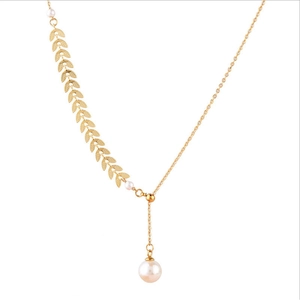 Golden wheat ear necklace with asymmetric chain and elegant pearl pendant on white background