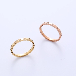 Honeycomb hex rings in gold and rose gold finishes featuring elegant zircon pavé settings
