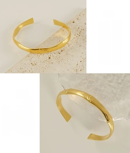 Macro detail of 18K gold stainless steel C-shaped cuff with bamboo texture finish