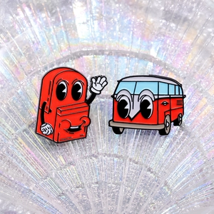 Red cartoon backpack and vintage bus enamel pins with big eyes on iridescent background