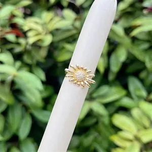 Detail of 18K gold plated sunflower ring featuring sparkling zircon pavé and petals