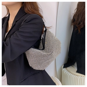 Chic silver rhinestone shoulder bag shown on model with sparkling crystal finish
