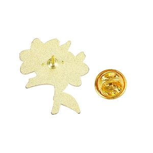 Detail of floral enamel pin back with matte gold finish and butterfly clutch closure