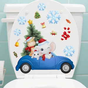 Detail of Christmas toilet lid stickers featuring cartoon animals in a blue car and snowflakes