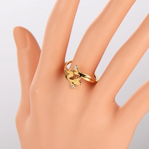 Golden double butterfly open ring with sparkling cubic zirconia on a model hand