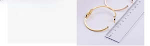 Detail of vacuum electroplated dolphin tail bracelets in gold and rose gold with rhinestones