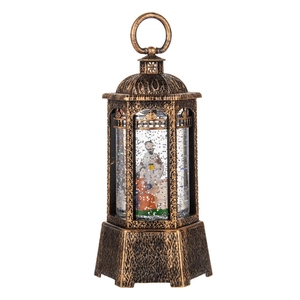 Vintage bronze Christmas lantern with swirling snowflakes and a miniature holy family scene