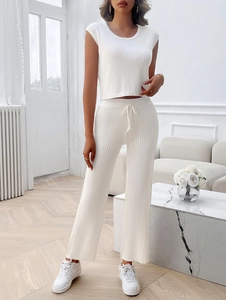 Detailed view of white ribbed knit two-piece set with drawstring wide-leg pants