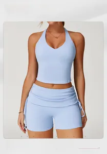 Detail of light blue racerback yoga vest with V-neck and moisture-wicking fabric