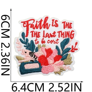Detail of embroidered patch showing Faith slogan with dimensions 6.4cm by 6cm