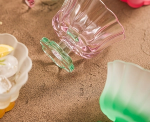 Detailed view of colorful glass dessert cups with petal texture and flower-shaped base