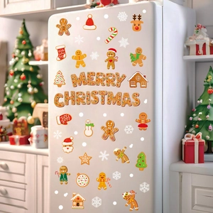 Gingerbread man and snowflake Christmas window static stickers set on a white fridge