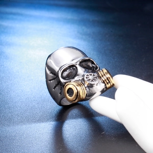 Retro stainless steel biker ring featuring silver skull and gold gas mask design