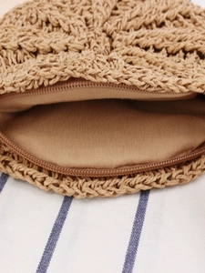 Handmade round straw woven coin purse with tassel and zipper closure for beach holidays