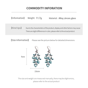 Detailed product specs of silver heart tassel earrings with dimensions and materials