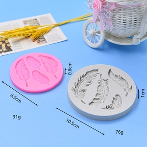 Silicone feather molds for cake decorating in pink and grey colors with size details