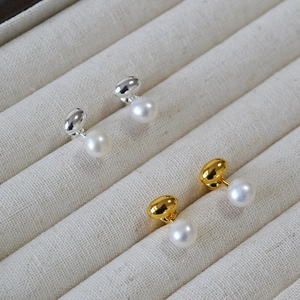 Elegant gold and silver brass pearl stud earrings set in a premium jewelry display box