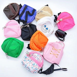Detailed top view of assorted mini backpack coin purses with zippers and hanging straps