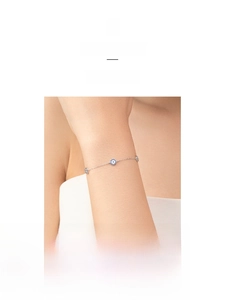 Detail of s925 silver Evil Eye bracelet with blue crystal and white pavé stones