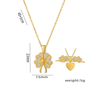 Turkish clover necklace with fold-out gold hearts and crystal inlay on white background