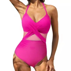 Hot pink one-piece swimsuit featuring a halter neck with cross-waist mesh patchwork