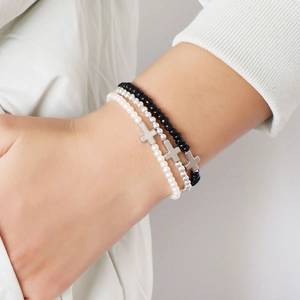 Three-piece stretch beaded bracelet set with faux pearls and silver cross charms for women