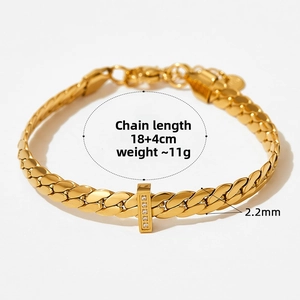 Detail of gold snake bone chain bracelet with crystal rectangle slider and lobster clasp