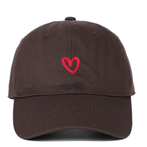 Close-up of red heart embroidery on a premium dark brown cotton baseball cap